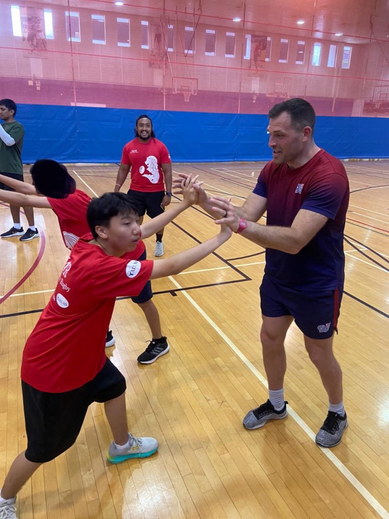 GB sevens players with children in Mixed Ability Rugby