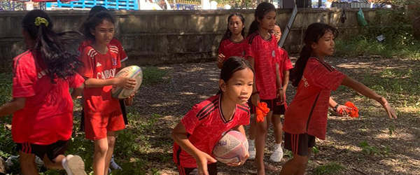 Girls playing rugby