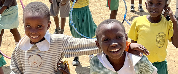 Happy Kenyan children with sports equipment