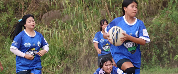 Girls play rugby